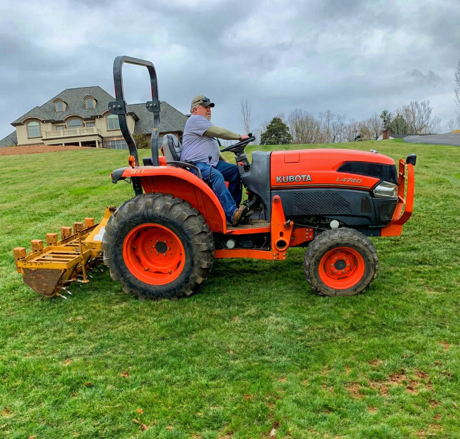 Kubota tractor maintaining a large estate property in Surry County